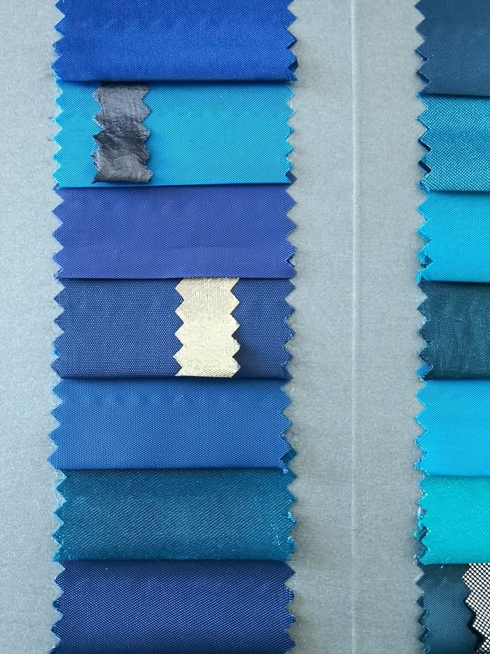 Fabric shade inspection and roll segregation for garment production