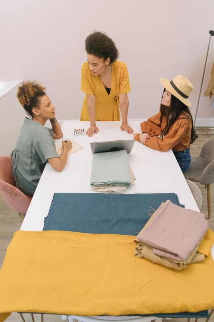 Apparel sourcing team reviewing fabrics and production requirements