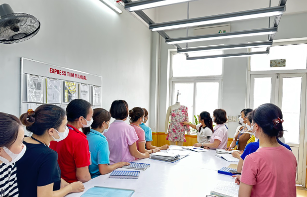 Apparel pre-production meeting reviewing bulk production requirements