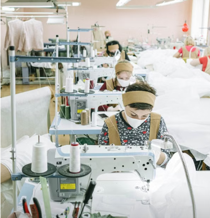 Garment factory sewing line workers during apparel production