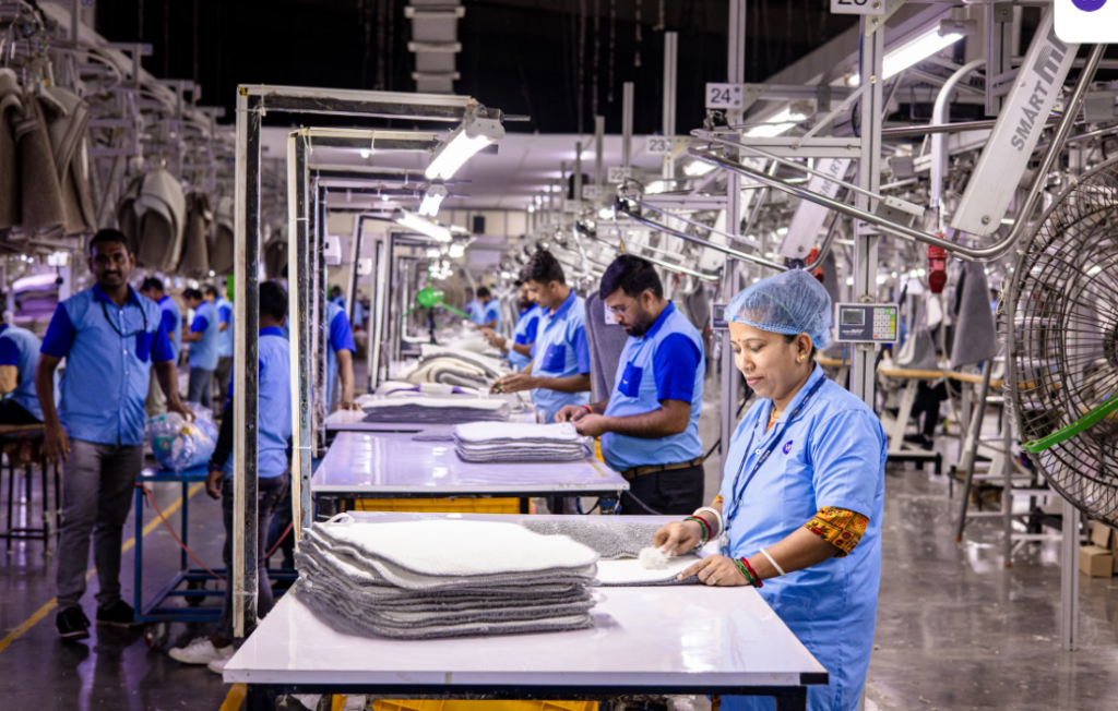 Alt Text:
Garment factory workers managing production and quality control