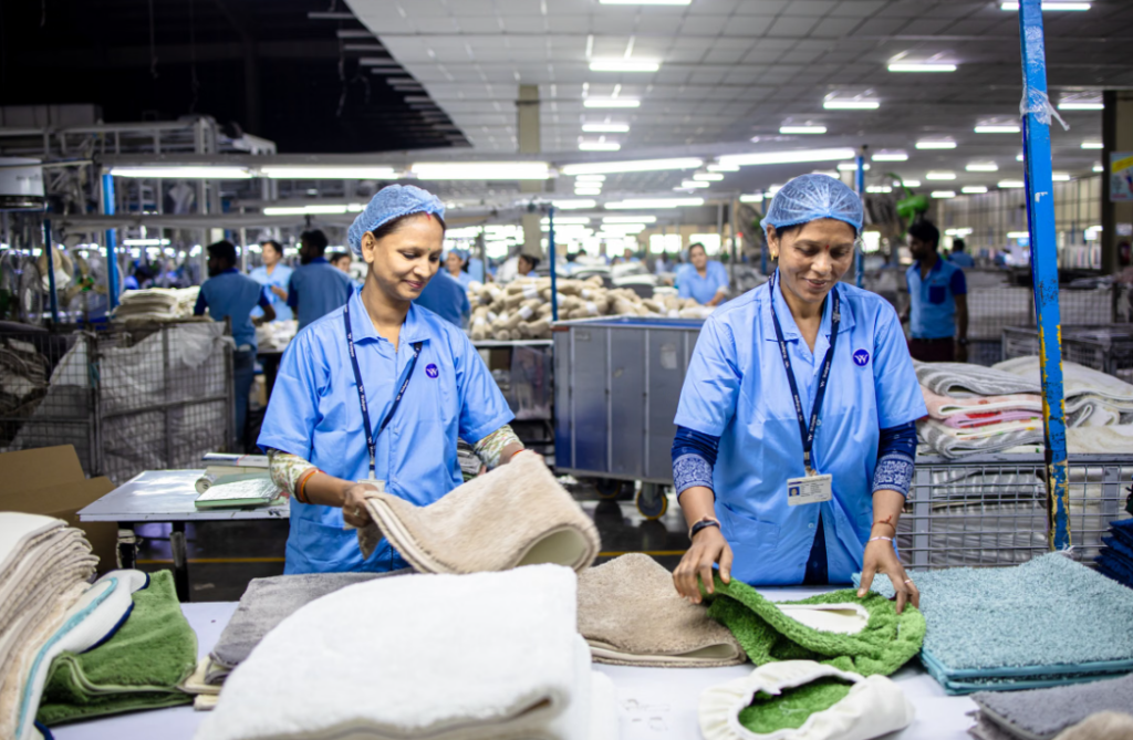 Apparel workers sorting fabric in a textile manufacturing facility